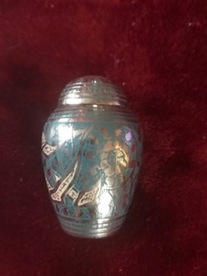Silver urn with Blue and White pattern.