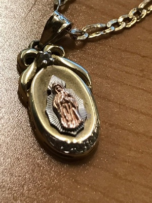 Close up of Virgin Mary pendant