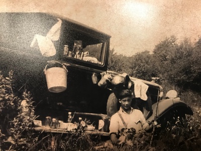 This photo of my grandfather, "Sonny", as a child well encompasses his interests: dogs, hunting, and (as you can see to his left) picnicking with classic Italian meats and cheeses.  