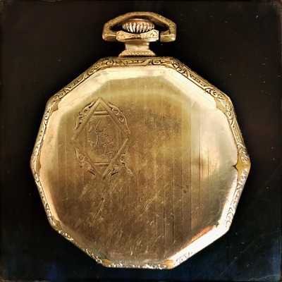 Back of pocket watch with initials