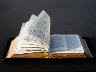 This bible looks a bit old also on the pages it has an orange color mixed with red.