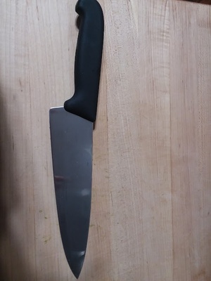 Steel chef's knife with plastic handle