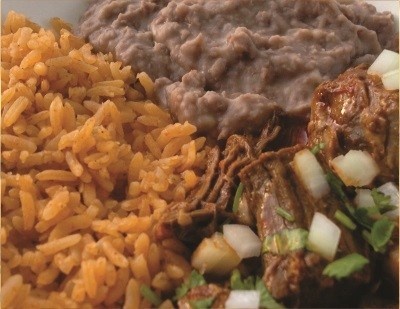Red rice, smashed beans, birria