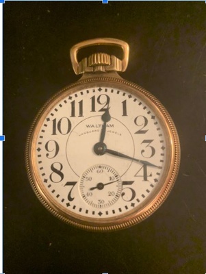 a photo of the pocket watch