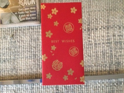 This is a Hoong Bao, or a red envelope.
