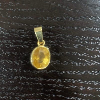 This is a yellow tourmaline pendant 