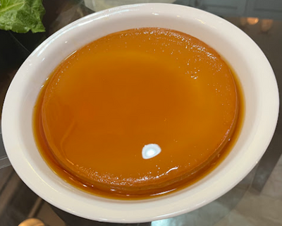A circular jelly-like leche flan.
