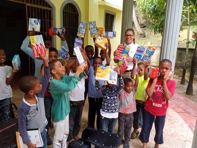 Edward donating to children in the DR
