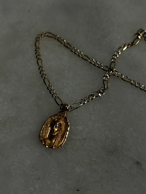 Golden necklace with Jesus face on end