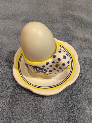 White alabaster darning egg in a dish