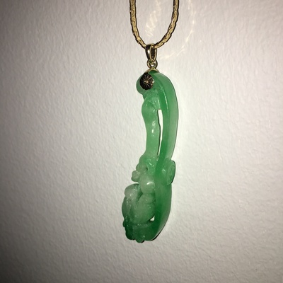 A pendant of carved jade