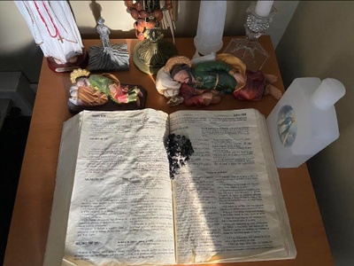 My mother's bible and religious statues