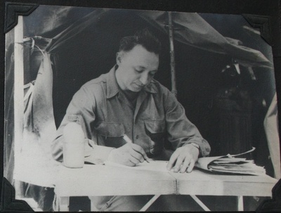 My grandfather writing in his journal 