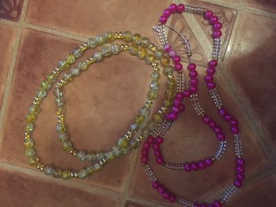 The photo show two different kind of waist beads. Both waist beads are different colors and have different styles.