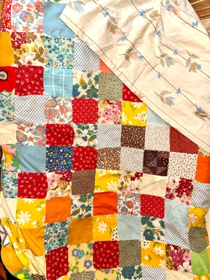 Quilt with a bedsheet on the back