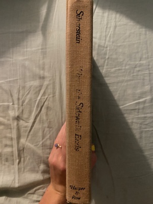 Worn-out book spine with title