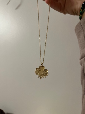 necklace with a dragon inside of clover