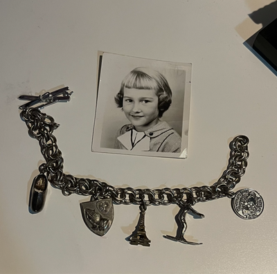 Silver charm bracelet, B&W photograph 