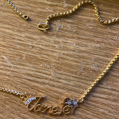 Golden Necklace with name and diamonds. 