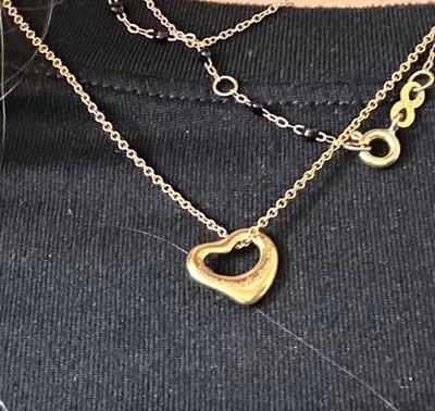 Gold necklace with hearts