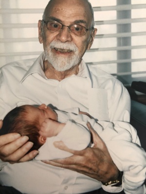 David holding me as a new born. 