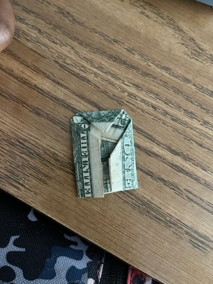 The dollar I found his pants pockets.