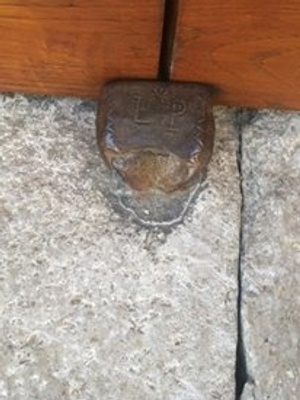 Engraved door stopper in Bagnoli, Italy 
