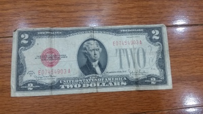It is a two dollar bill made in 1928.