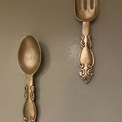 A huge silver spoon and fork set 