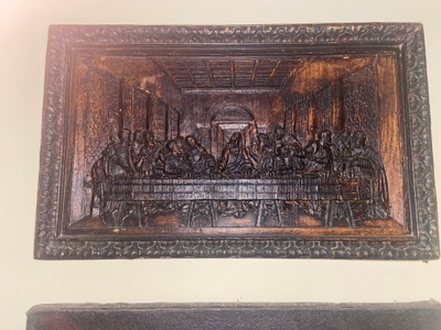 Wooden carving of the Last Supper.