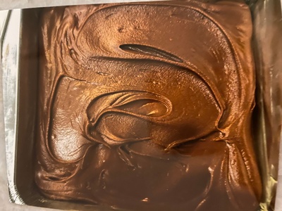 Chocolate fudge in a metal pan