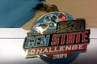 A medal has fake colorful gems.