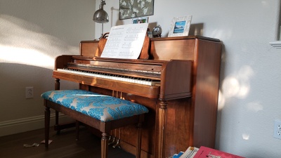 A dark amber-colored piano