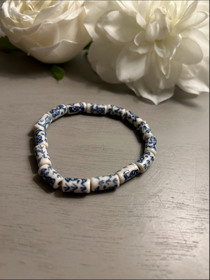 White bracelet with royal blue fish