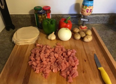 Prep for Beef Empanadas with ingredients.  My familys famous empanada recipe includes: pork, garlic, onions, green peppers, sazon, recaito, sofrito, potatoes, and green olives.