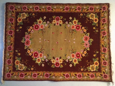 A large, floral, rectangular rug.