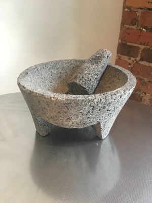 A molcajete is a bowl made out of stone.