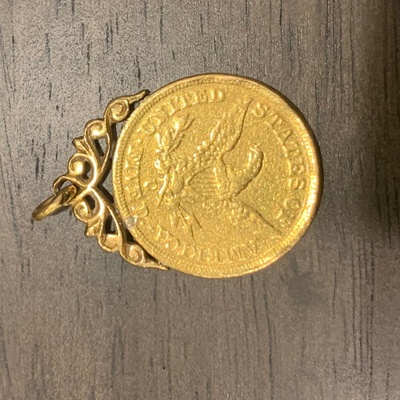 Gold medallion (other side) contains image of eagle and the words 'United States of America Fived'  