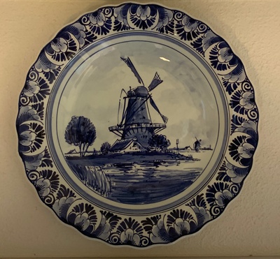 Delft Blue plate with an east-facing windmill beside a canal