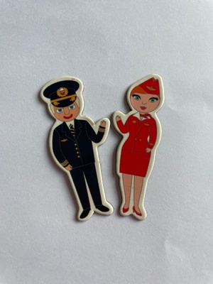 Tiny figures of a pilot and a stewardess