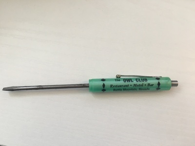 Small green flathead screwdriver 