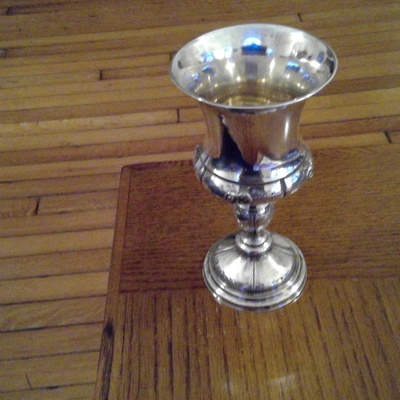 It is a sterling silver cup.