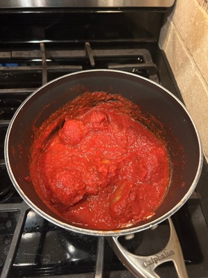 Spaghetti sauce simmering in the pot. 