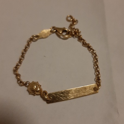 Gold bracelet, ladybug, & name on plate