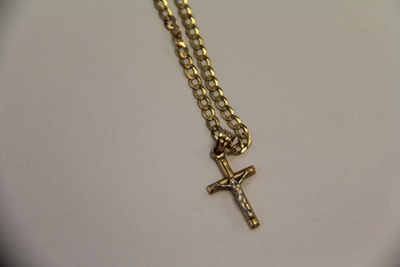 Gold cuban link with crucifix. 