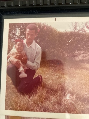 Grandfather holding infant mother