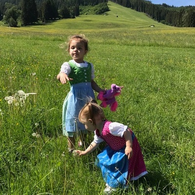 My niece and daughter in their Diandls casually playing in the fields of Austria. 