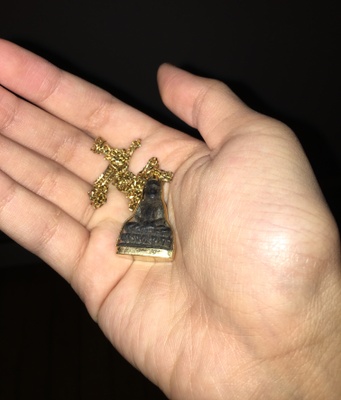 ~ An 18 karat gold Buddha necklace that has been with me ever since I was born.