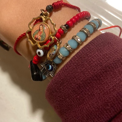 These are the bracelets made by my aunt. The two red ones were given to me when I was a young child (All of these bracelets were given to me by my aunt).