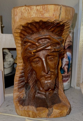 Wood carving of the face of Jesus